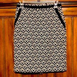 Women’s Dressy Skirt in a navy blue and white pattern. Excellent condition.